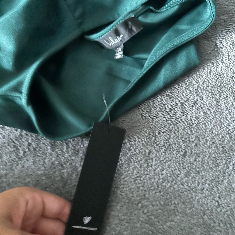 Green Lulu’s Jumpsuit with tags.